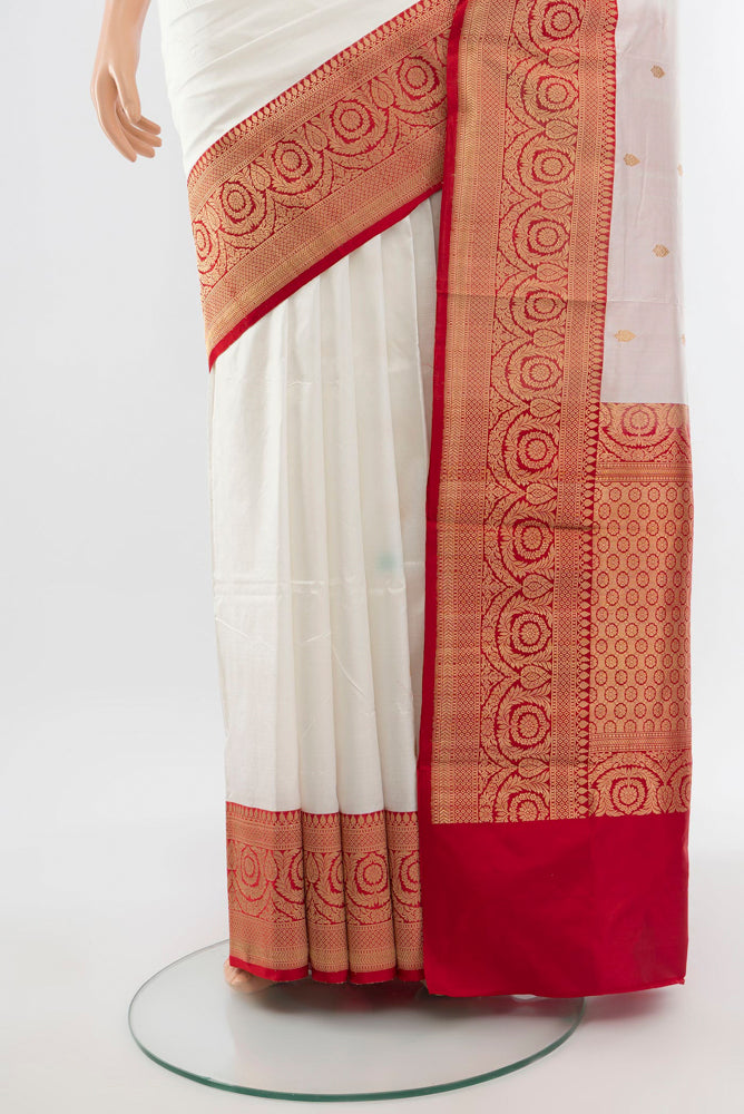 Pleats and pallu of Cream Banarasi Katan Silk Saree with Zari Butta on the body and Silk Border. 