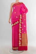 Pure Silk Rani Pink Banarasi Katan Saree with Zari Butta on the body and Zari Border.  displayed on a mannequin