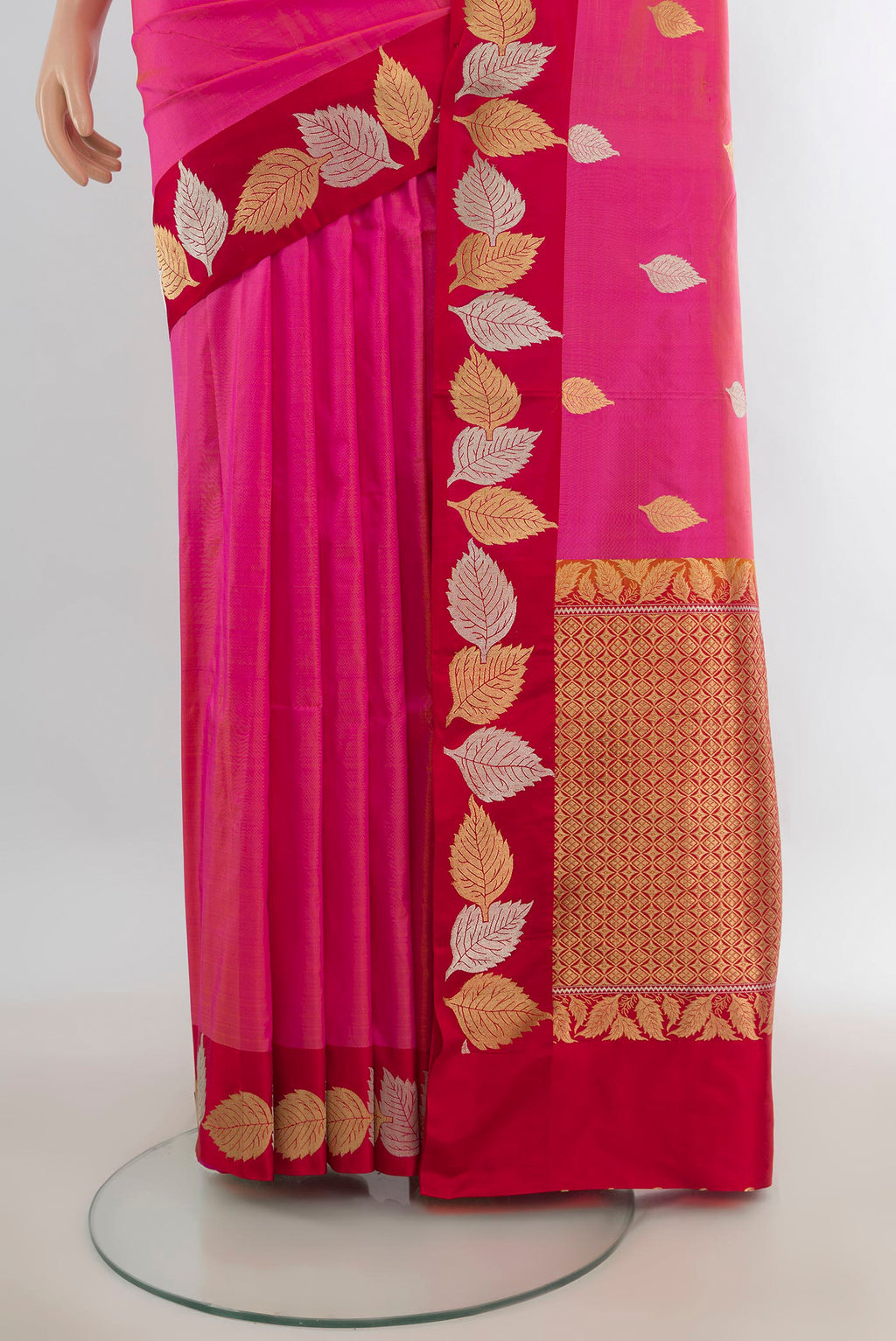 Pleats and pallu of Pure Silk Rani Pink Banarasi Katan Saree with Zari Butta on the body and Zari Border. 