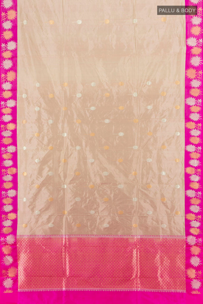 Flat view of Beige Banarasi Katan Silk Saree with Zari Butta on the body and Silk Border. 