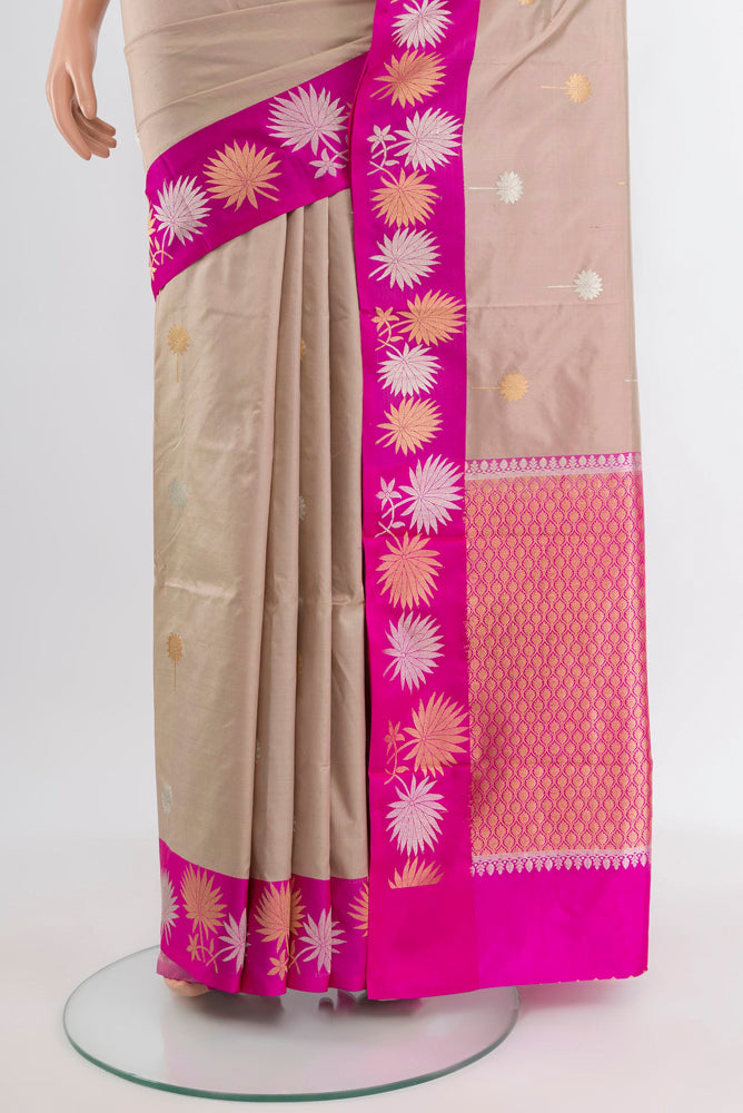 Pleats and pallu of Beige Banarasi Katan Silk Saree with Zari Butta on the body and Silk Border. 