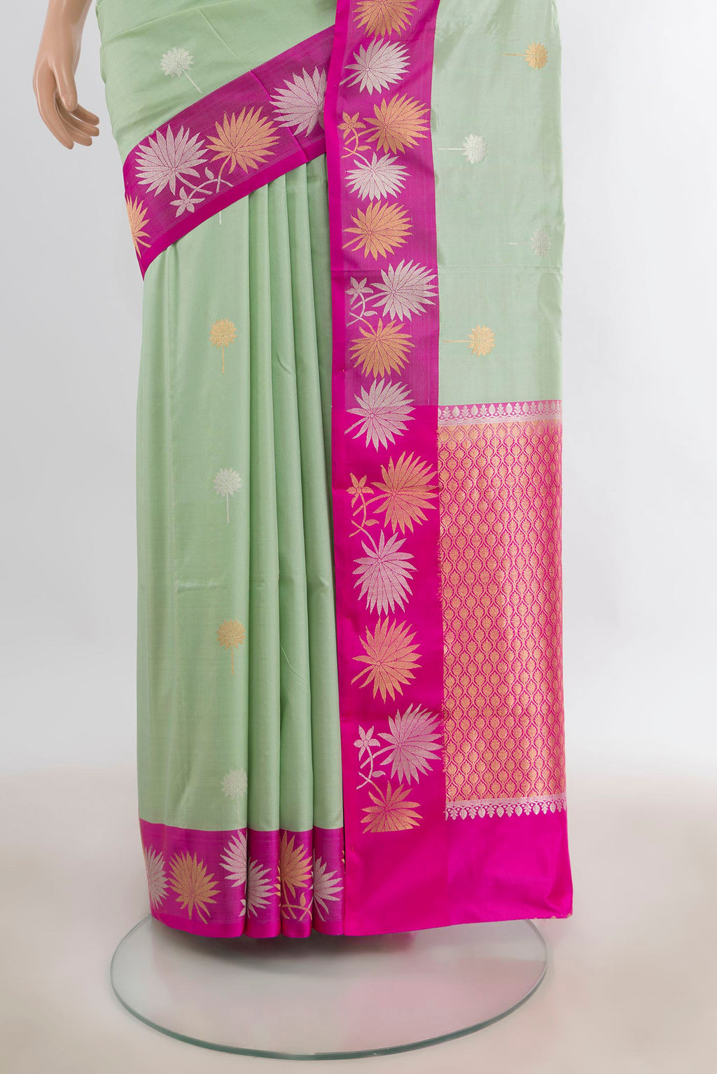 Pleats and pallu of Pure Silk Pista Green Banarasi Katan Saree with Zari Butta on the body and Zari Border. 