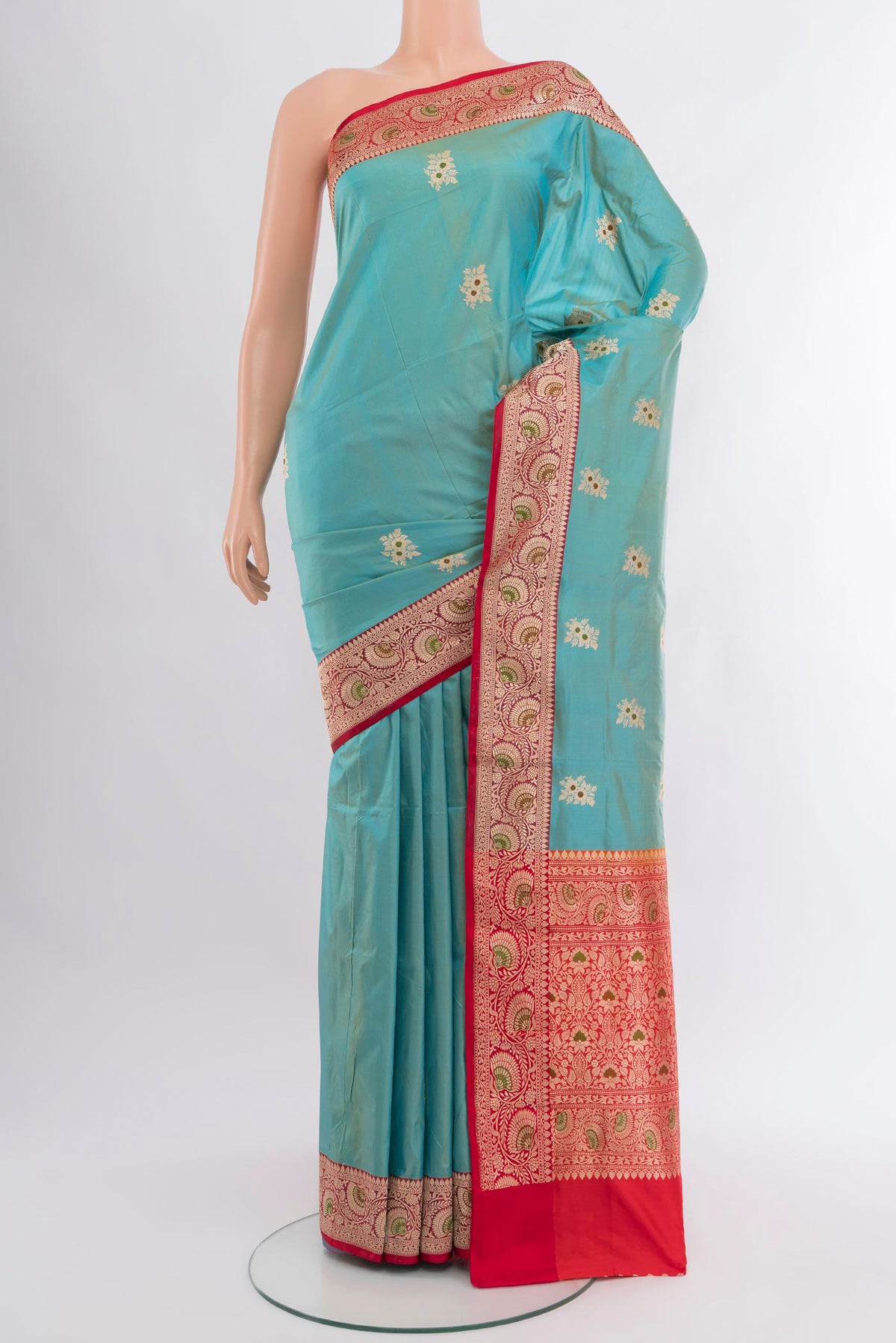 Light Blue Banarasi Katan Silk Saree with Zari Butta on the body and Zari Border.  displayed on a mannequin