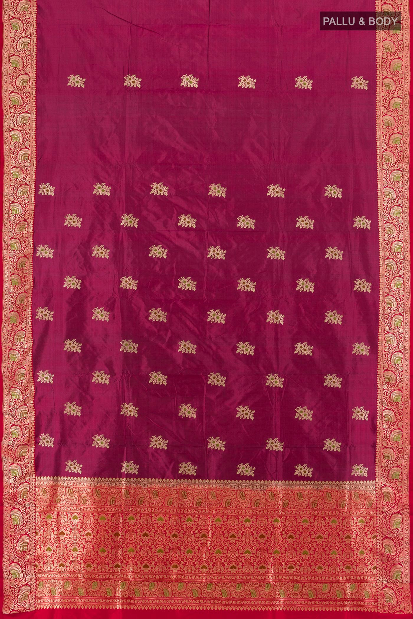 Flat view of Magenta Banarasi Katan Silk Saree with Zari Butta on the body and Zari Border. 