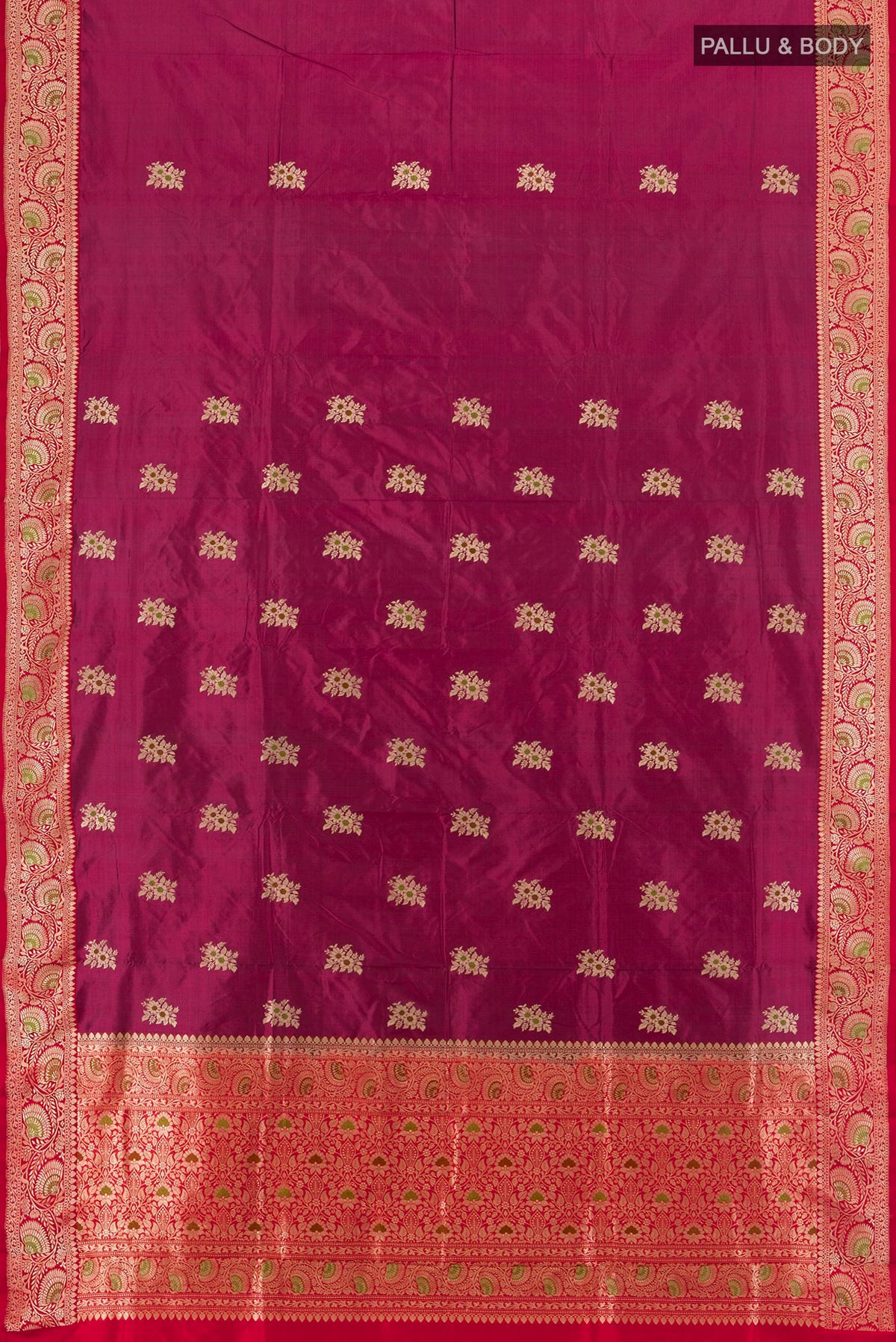 Flat view of Magenta Banarasi Katan Silk Saree with Zari Butta on the body and Zari Border. 