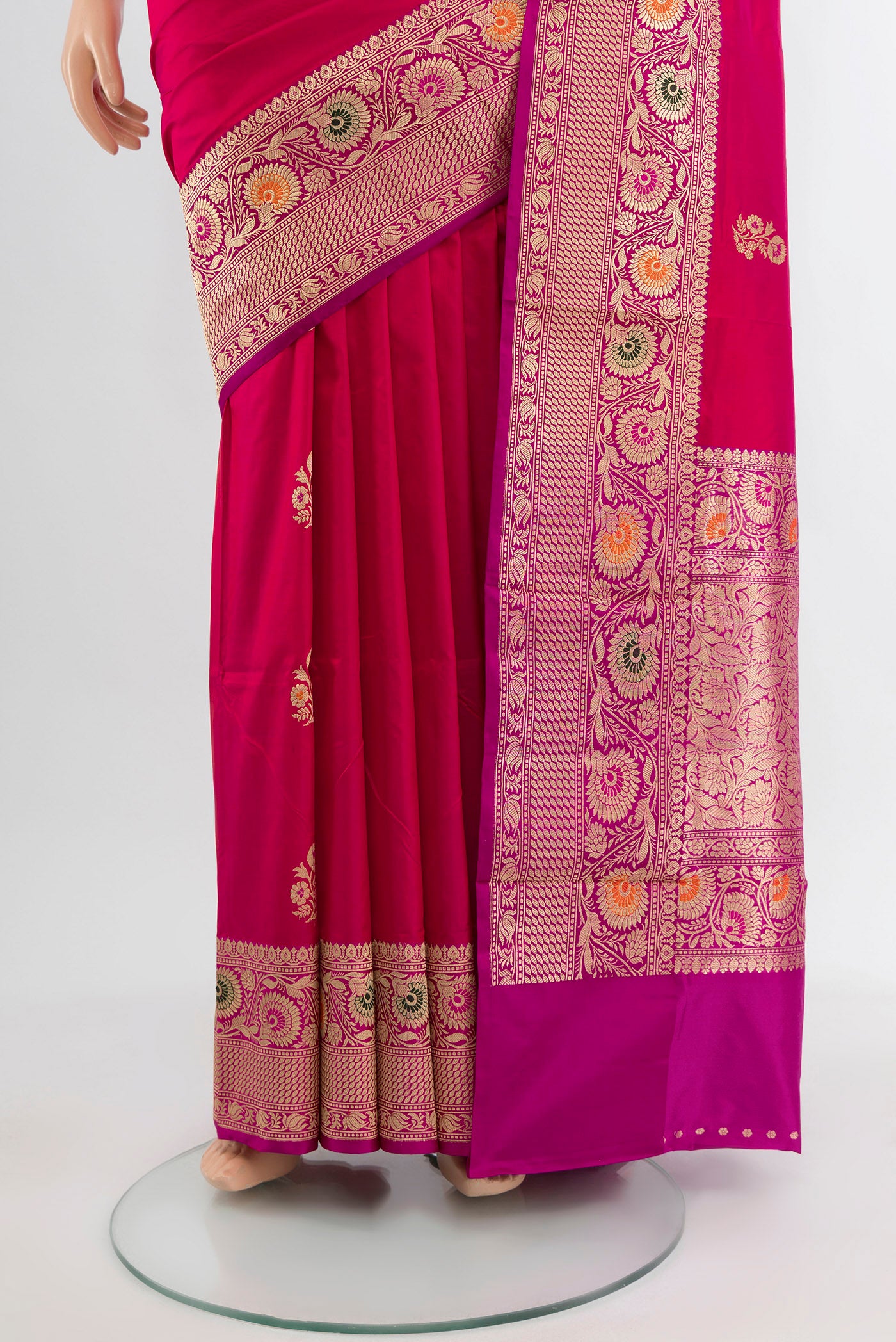 Pleats and pallu of Dark Pink Baluchari Silk Saree with Zari Butta on the body and Silk Border. 