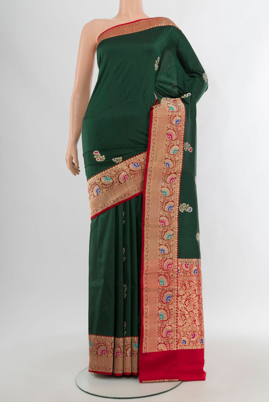 Bottle Green Banarasi Katan Silk Saree with Zari Butta on the body and Zari Border.  displayed on a mannequin