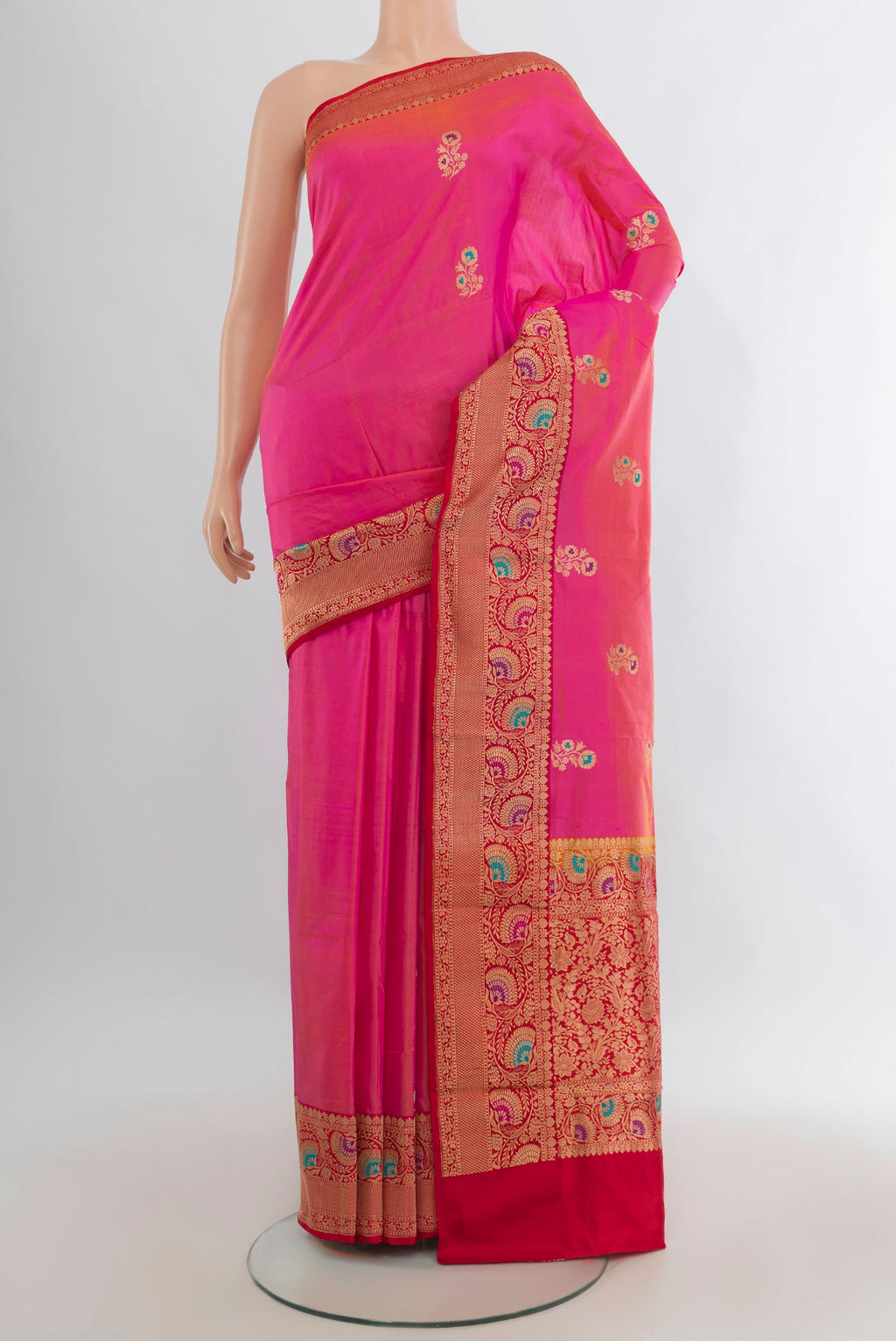 Pure Silk Pink Banarasi Katan Saree with Zari Butta on the body and Zari Border.  displayed on a mannequin