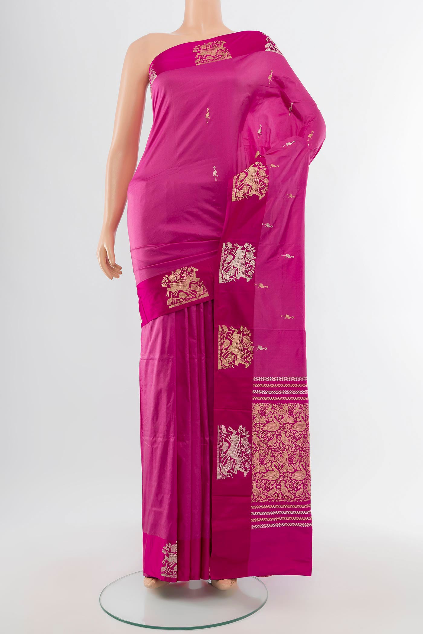 Bronze Banarasi Katan Silk Saree with Zari Butta on the body and Silk Border.  displayed on a mannequin