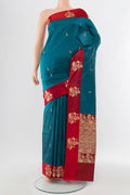 Dark Blue Banarasi Katan Silk Saree with Zari Butta on the body and Silk Border.  displayed on a mannequin