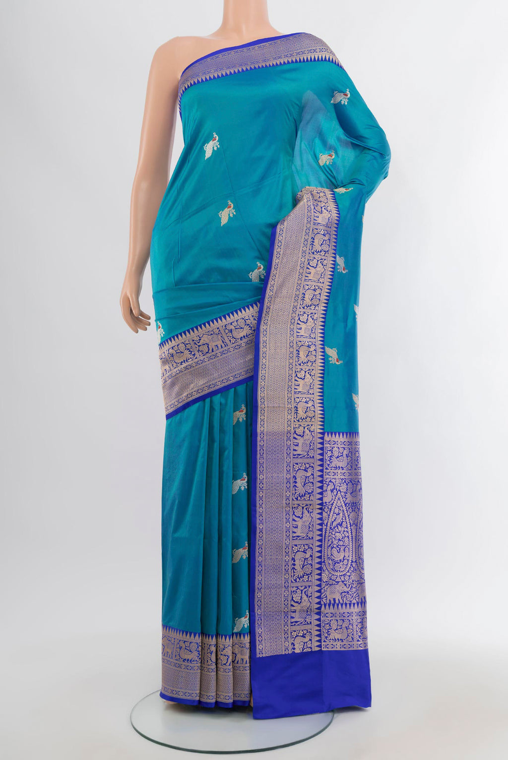 Light Blue Banarasi Katan Silk Saree with Zari Butta on the body and Zari Border.  displayed on a mannequin