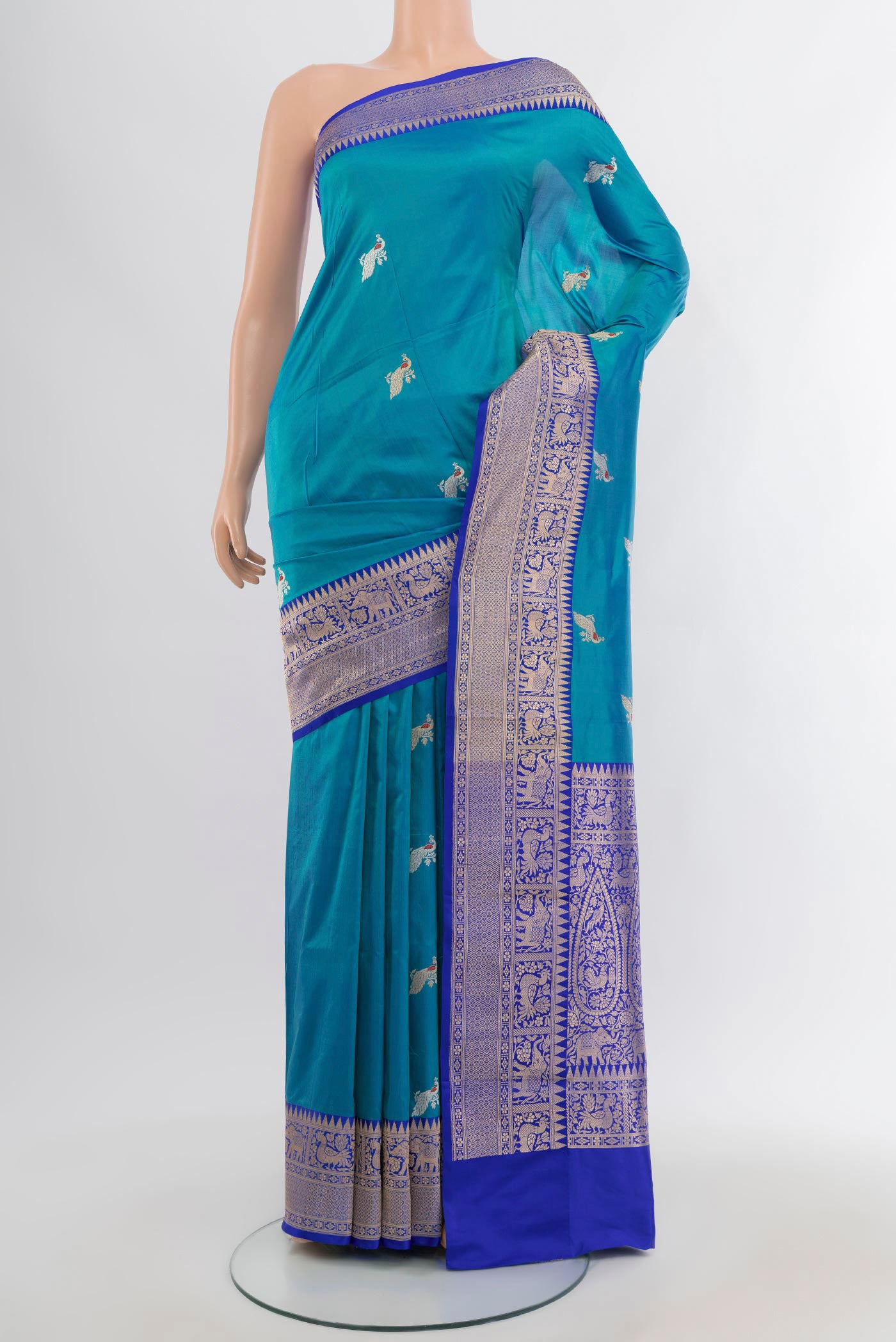 Light Blue Banarasi Katan Silk Saree with Zari Butta on the body and Zari Border.  displayed on a mannequin