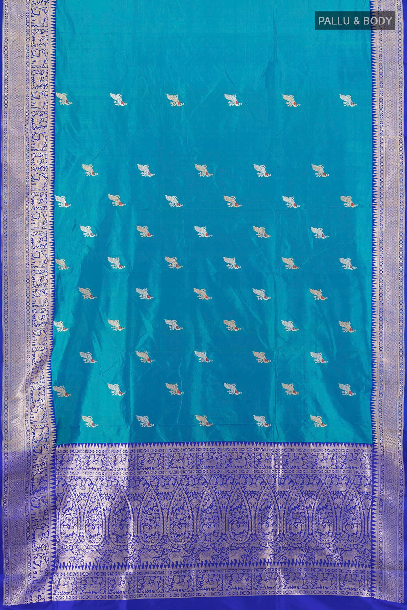 Flat view of Light Blue Banarasi Katan Silk Saree with Zari Butta on the body and Zari Border. 