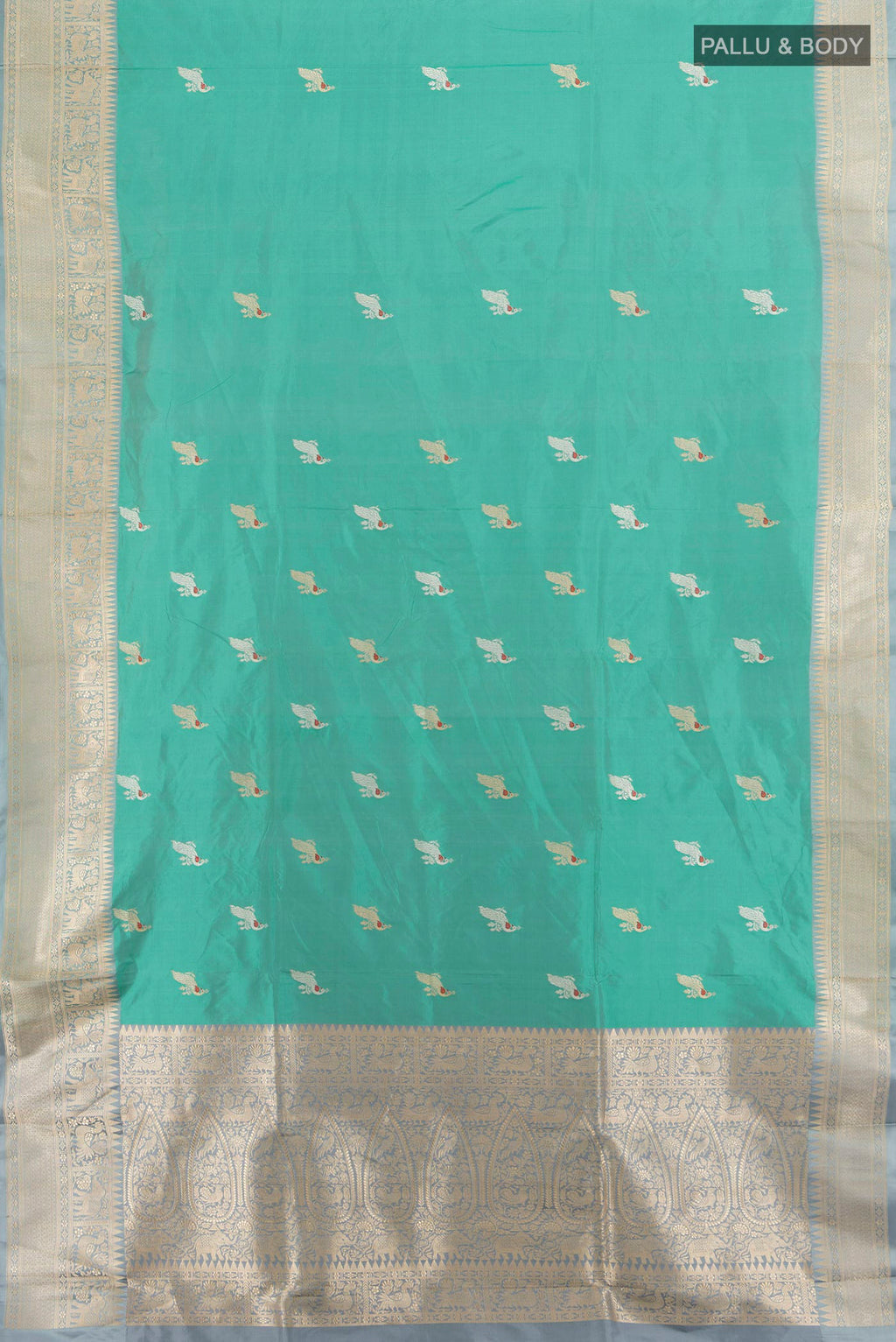 Flat view of Pure Silk Green Banarasi Katan Saree with Zari Butta on the body and Zari Border. 