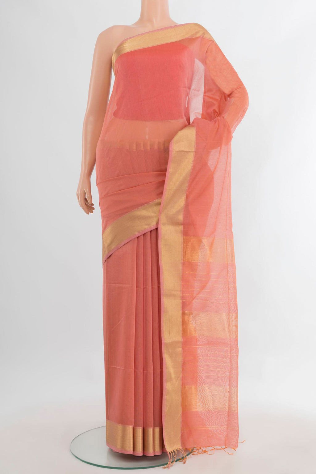 Peach Maheshwari Cotton Saree with Plain Body and Zari Border.  displayed on a mannequin