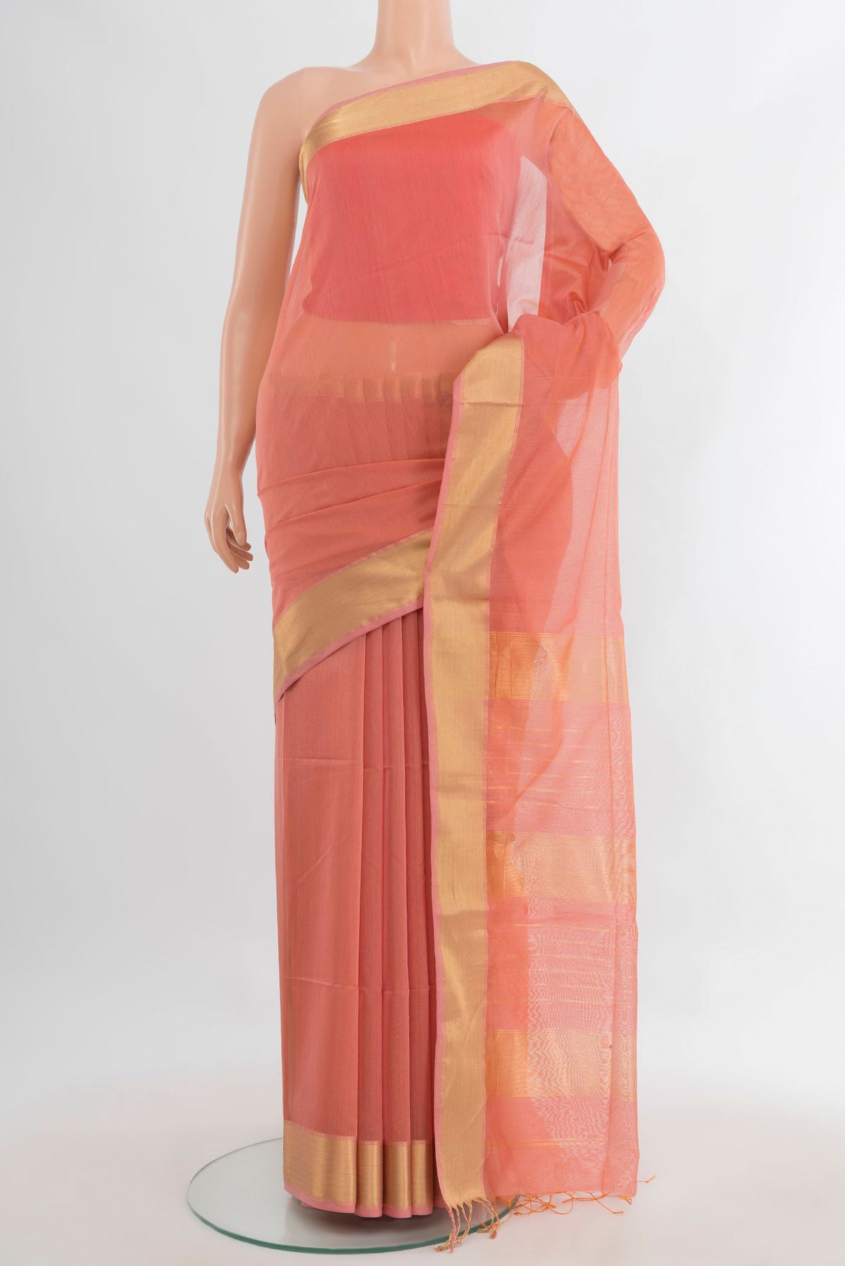 Peach Maheshwari Cotton Saree with Plain Body and Zari Border.  displayed on a mannequin