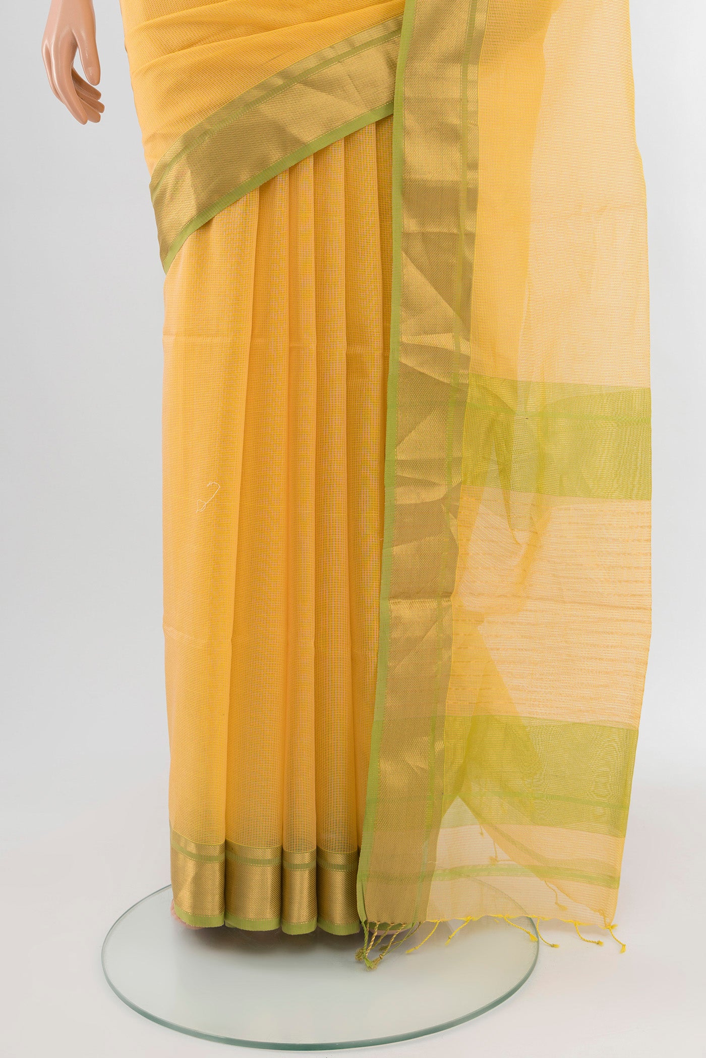 Pleats and pallu of Yellow Maheshwari Silk Cotton Saree with Checked design on the body and Zari Border. 