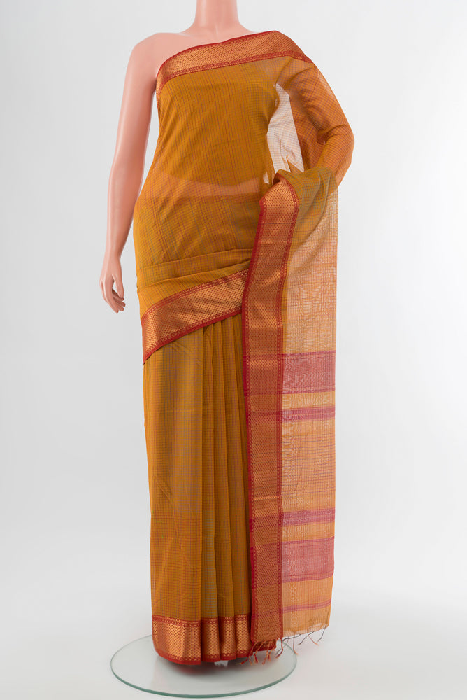 Mustard Maheshwari Silk Cotton Saree with Checked design on the body and Silk Border.  displayed on a mannequin