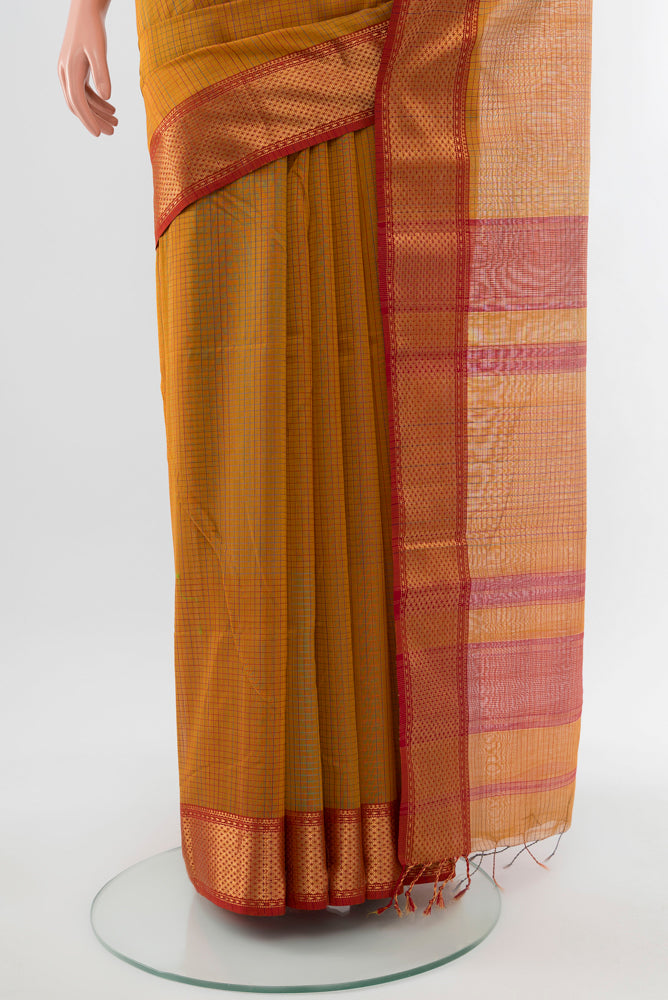 Pleats and pallu of Mustard Maheshwari Silk Cotton Saree with Checked design on the body and Silk Border. 