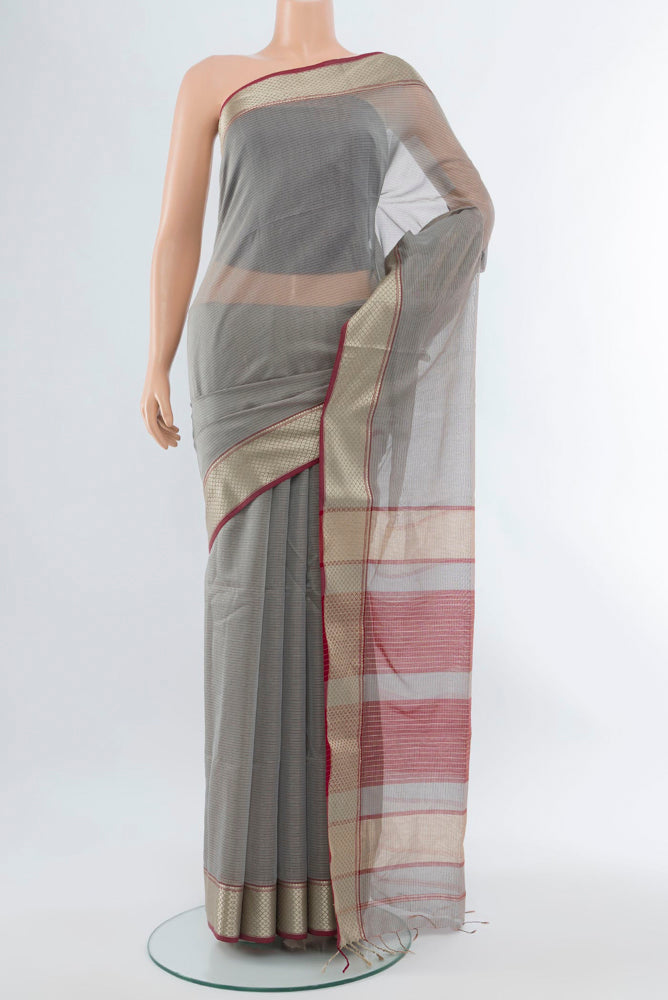 Davys Grey Maheshwari Silk Cotton Saree with Zari Butta on the body and Silk Border.  displayed on a mannequin