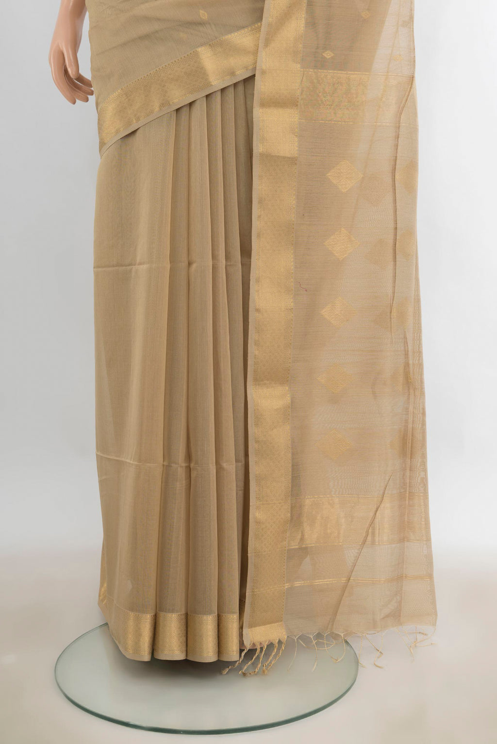 Pleats and pallu of Beige Maheshwari Cotton Saree with Zari Butta on the body and Zari Border. 