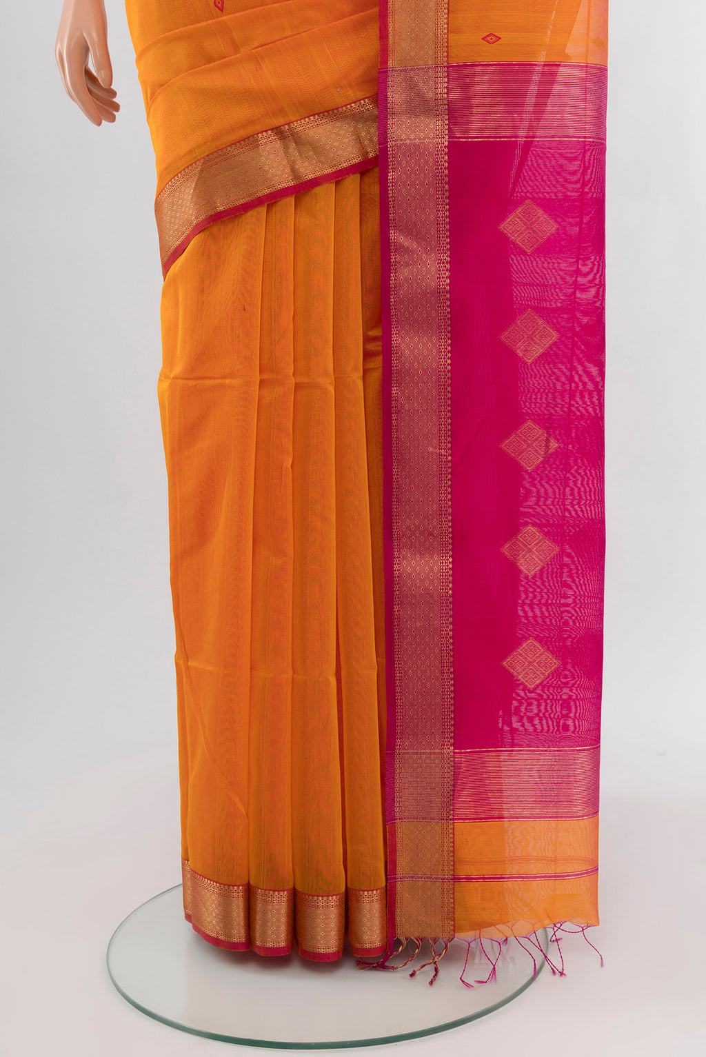 Pleats and pallu of Mustard Maheshwari Silk Cotton Saree with Zari And Thread Butta on the body and Zari Border. 