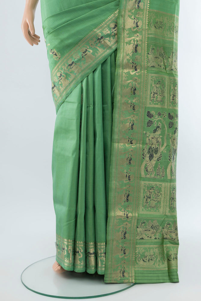 Pleats and pallu of Light Green Baluchari Silk Saree with Zari Butta on the body and Silk Border. 