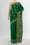 Pure Silk Green Baluchari Saree with Zari And Thread Butta on the body and Zari Border.  displayed on a mannequin