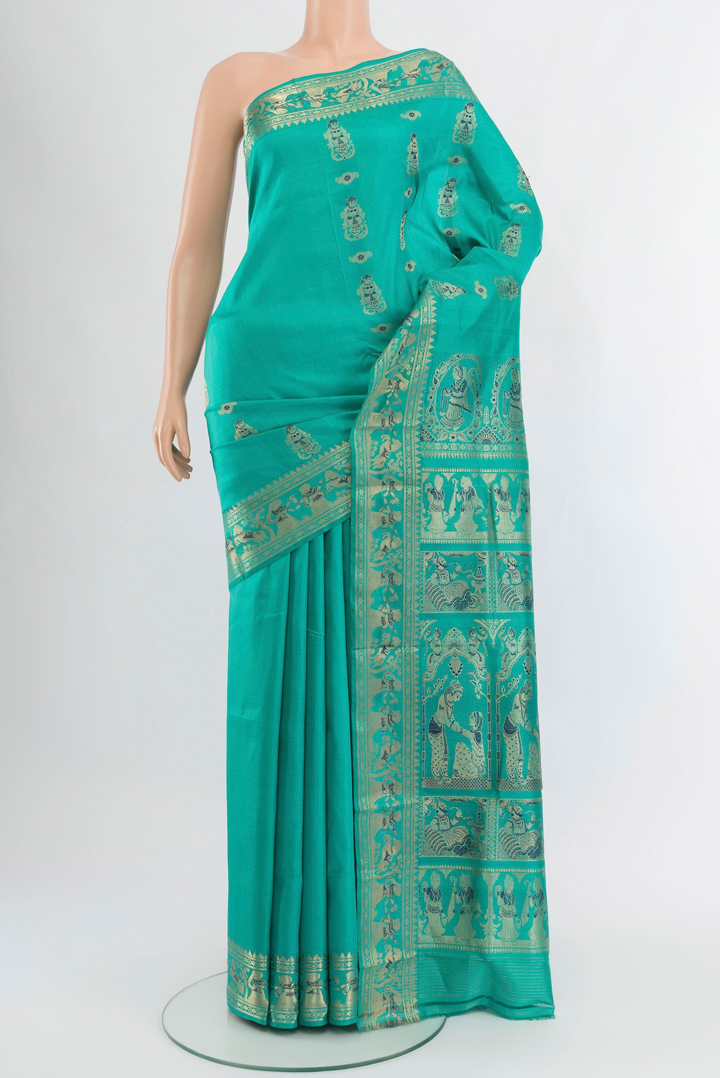 Turquoise Baluchari Silk Saree with Zari And Thread Butta on the body and Zari Border.  displayed on a mannequin