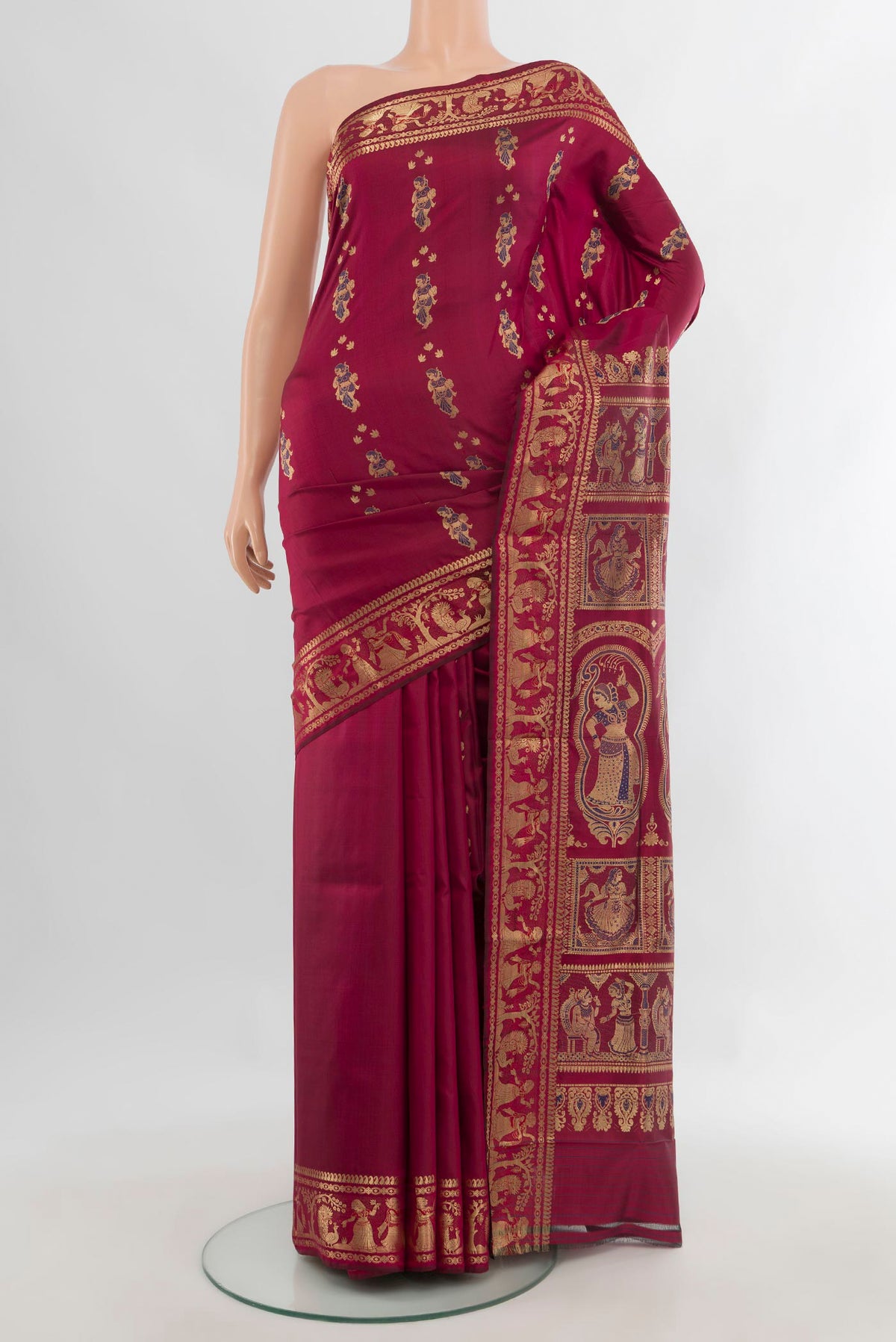 Pure Silk Maroon Baluchari Saree with Zari Butta on the body and Zari Border.  displayed on a mannequin