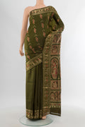 Mehandi Green Baluchari Silk Saree with Zari Butta on the body and Zari Border.  displayed on a mannequin
