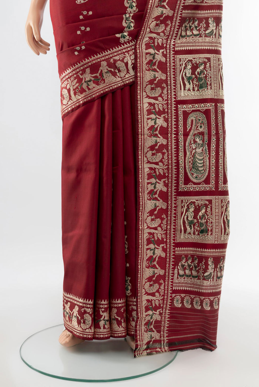 Pleats and pallu of Maroon Baluchari Silk Saree with Zari Butta on the body and Silk Border. 