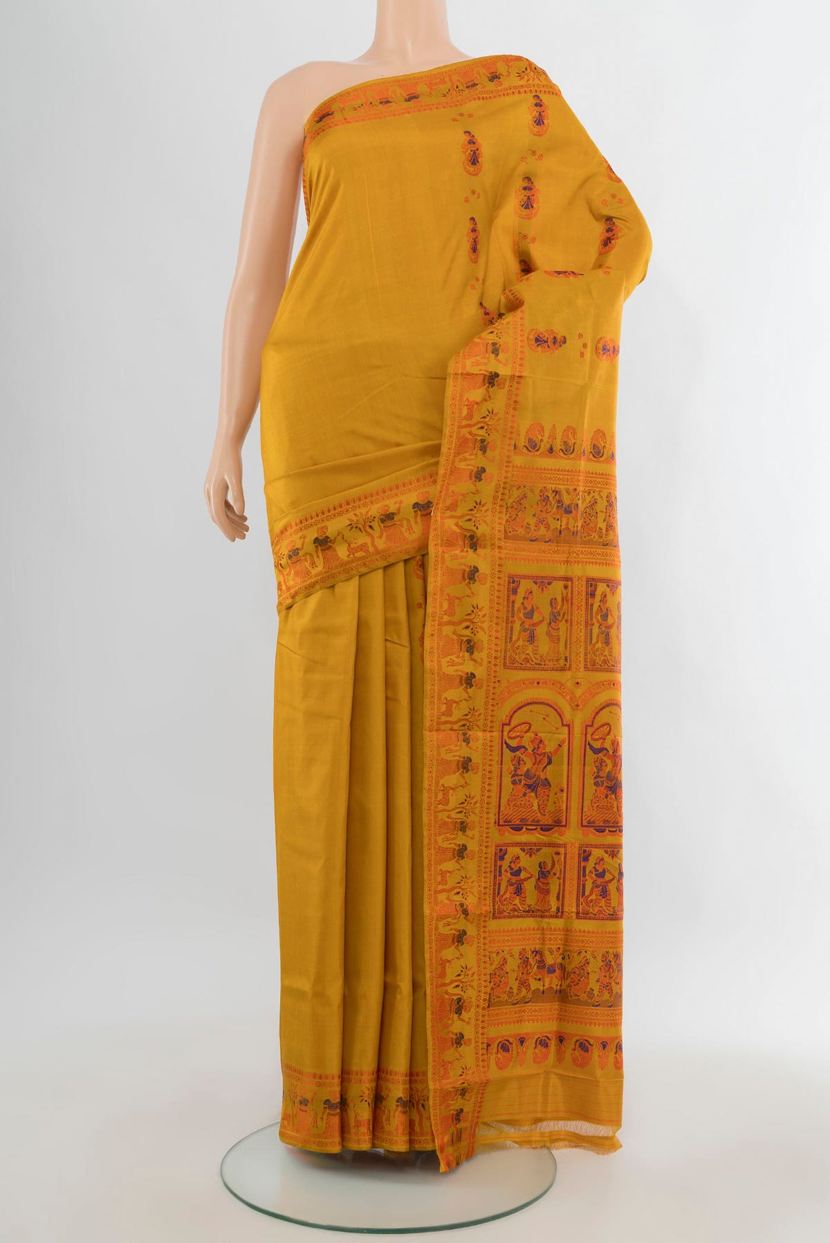Pure Silk Mustard Baluchari Saree with Thread Butta on the body and Thread Border.  displayed on a mannequin