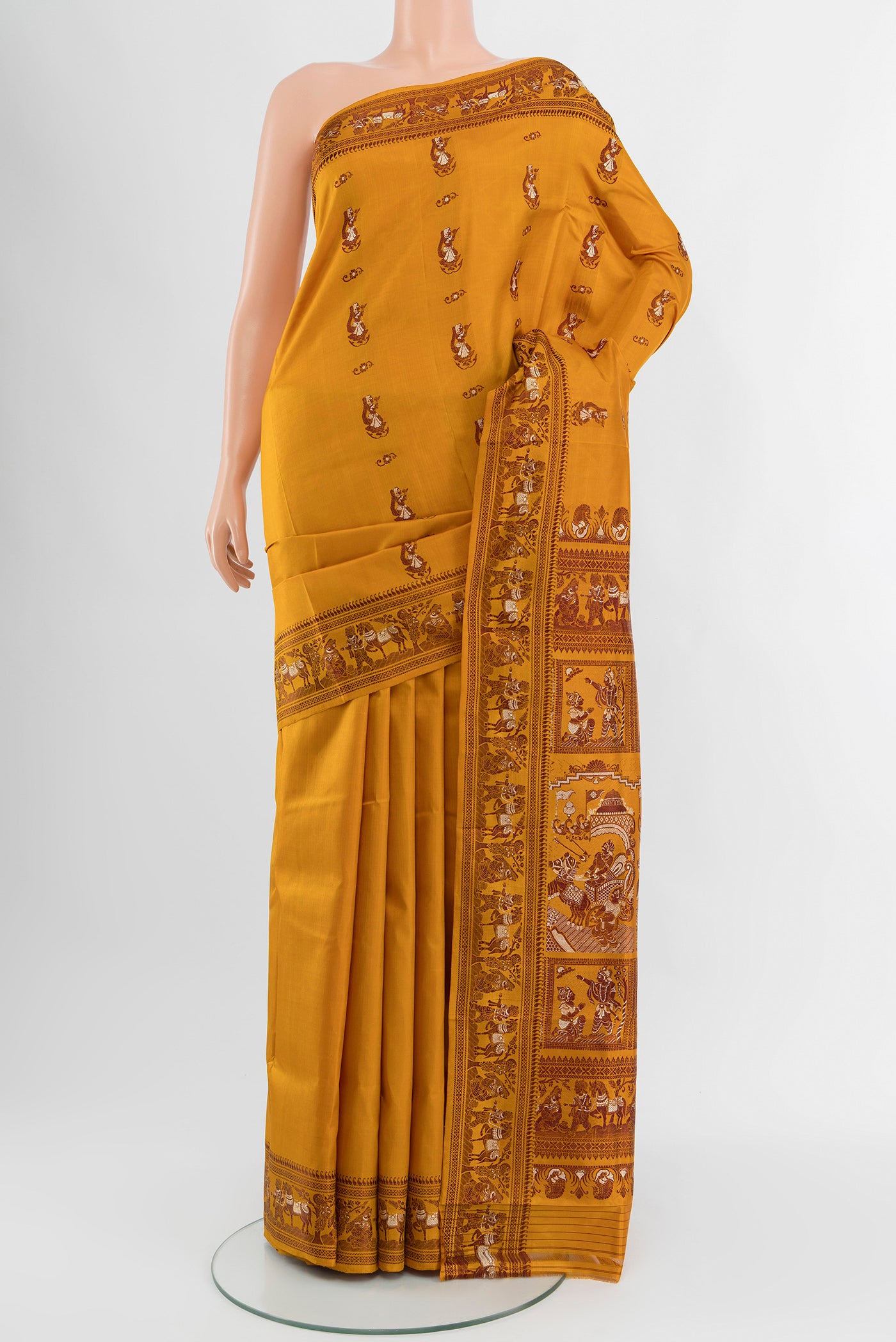 Mustard Baluchari Silk Saree with Thread Butta on the body and Thread Border.  displayed on a mannequin