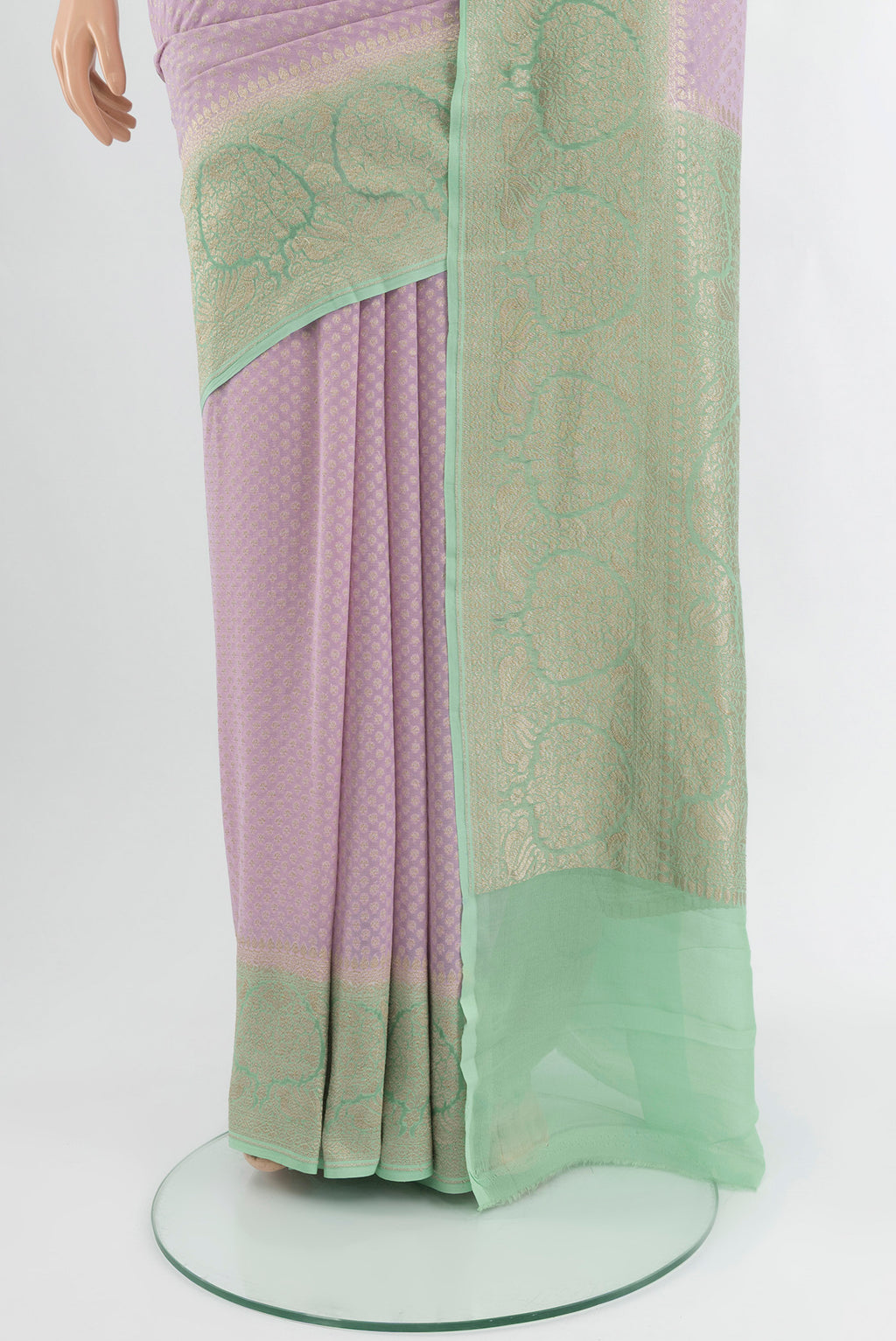Pleats and pallu of Lavender Banarasi Georgette Saree with Zari Butta on the body and Zari Border. 