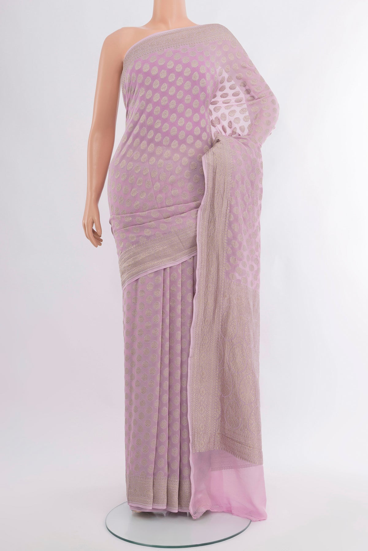 Lavender Banarasi Georgette Saree with Zari Butta on the body and Zari Border.  displayed on a mannequin