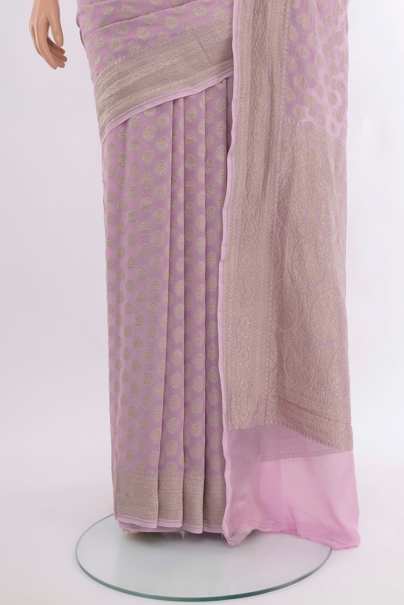 Pleats and pallu of Lavender Banarasi Georgette Saree with Zari Butta on the body and Zari Border. 