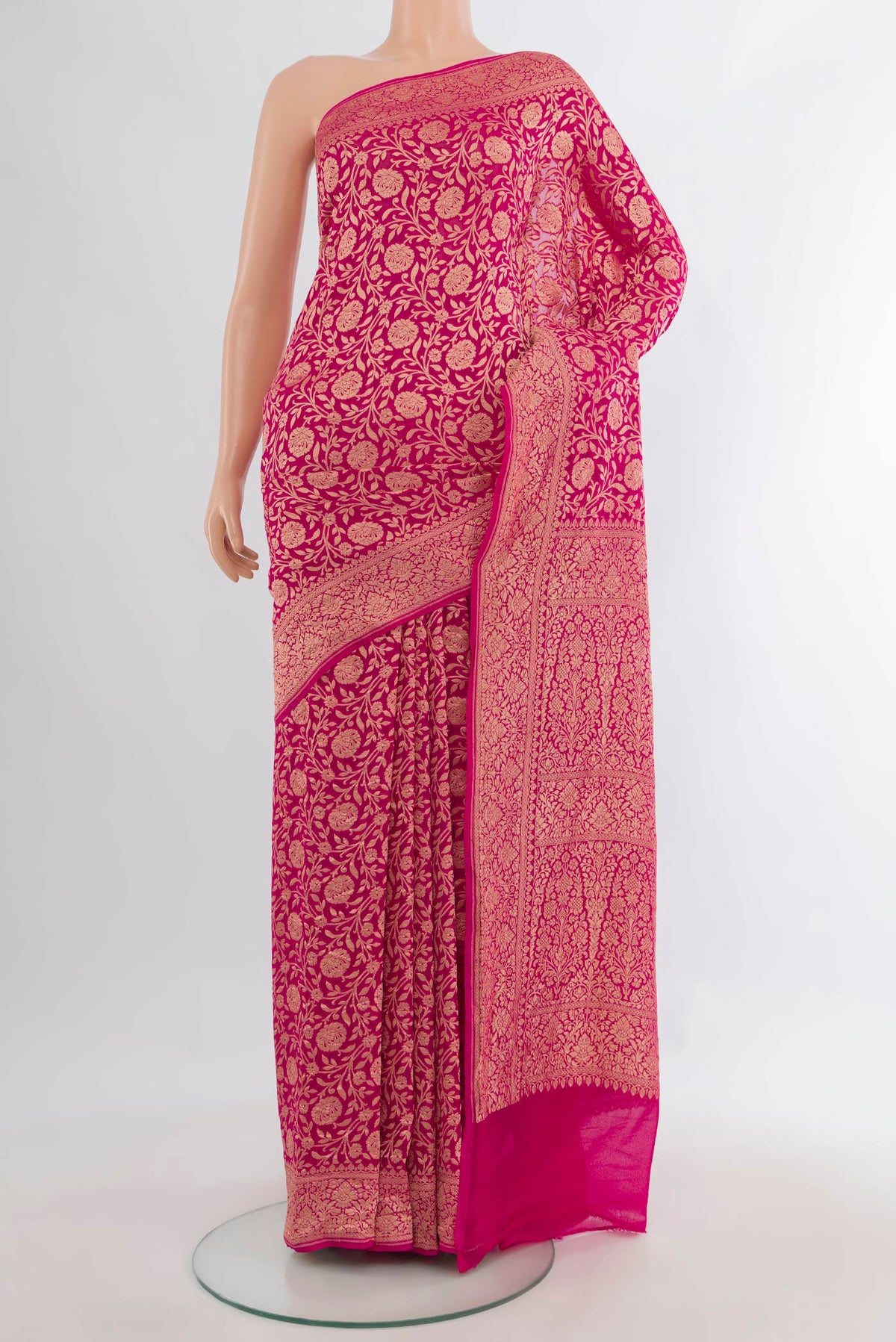 Pink Banarasi Georgette Saree with Zari Brocade on the body and Zari Border.  displayed on a mannequin