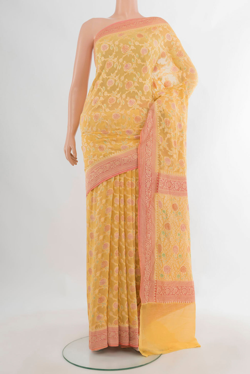Yellow Banarasi Georgette Saree with Zari Brocade on the body and Zari Border.  displayed on a mannequin