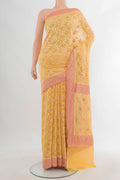 Yellow Banarasi Georgette Saree with Zari Brocade on the body and Zari Border.  displayed on a mannequin