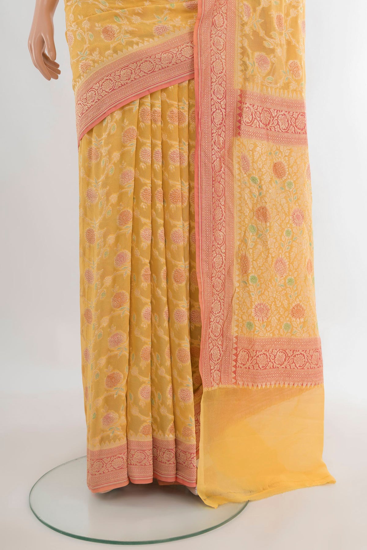 Pleats and pallu of Yellow Banarasi Georgette Saree with Zari Brocade on the body and Zari Border. 