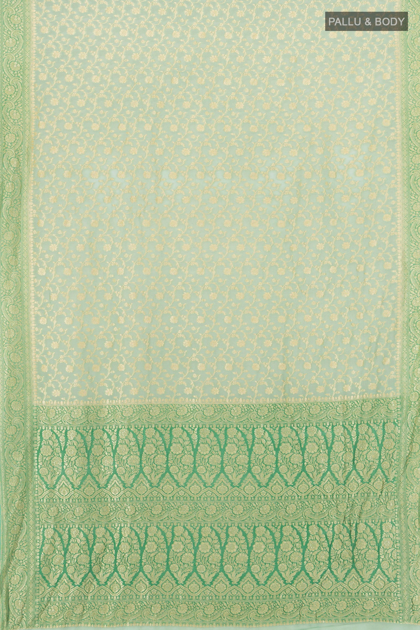 Flat view of Light Green Banarasi Georgette Saree with Zari Brocade on the body and Zari Border. 