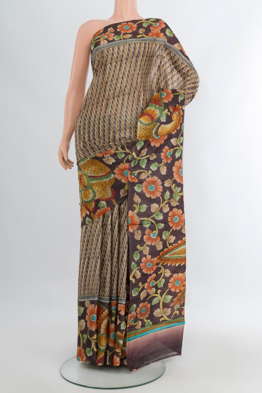 Beige Tussar Silk Saree with Printed design on the body and Zari Border.  displayed on a mannequin
