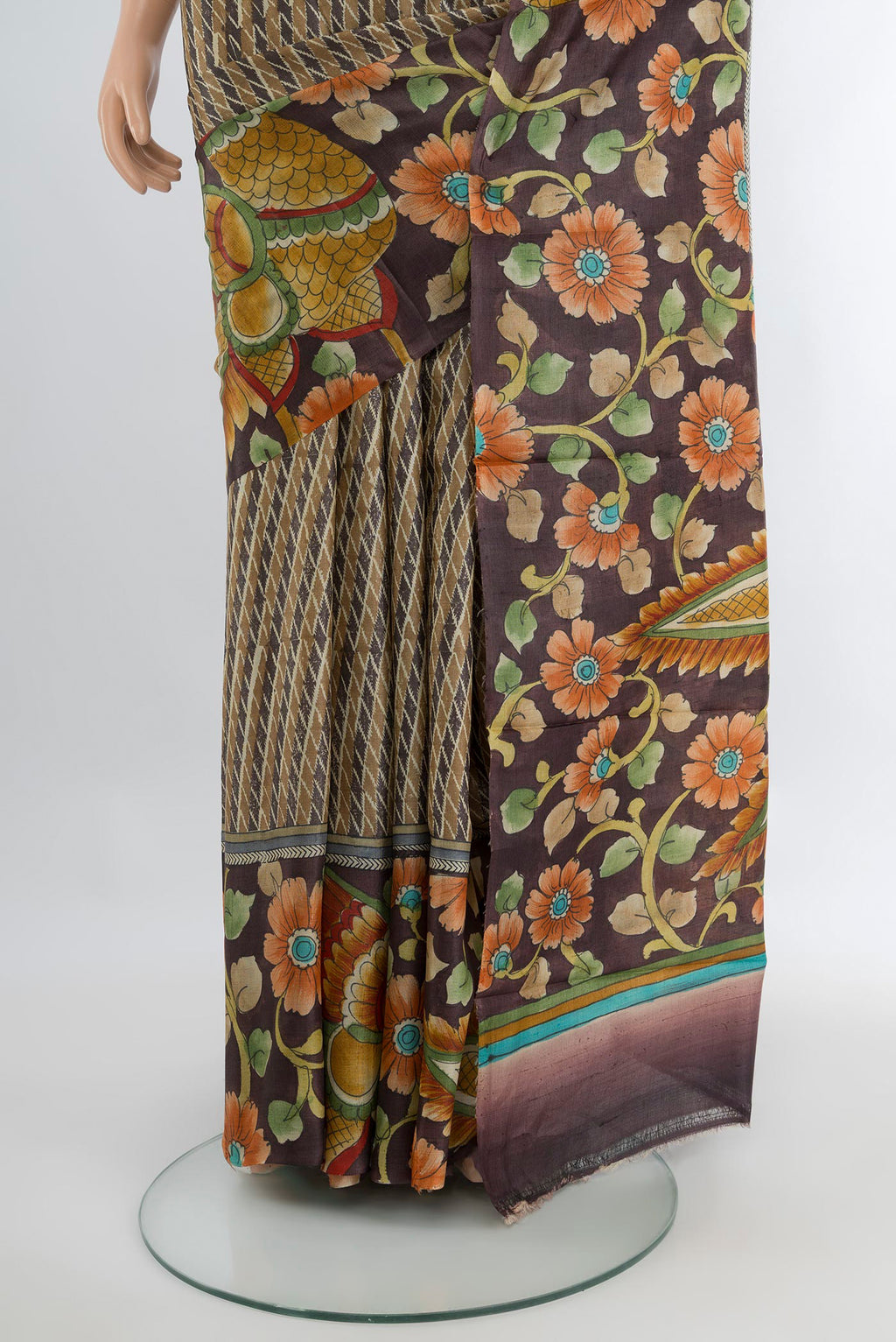 Pleats and pallu of Beige Tussar Silk Saree with Printed design on the body and Zari Border. 