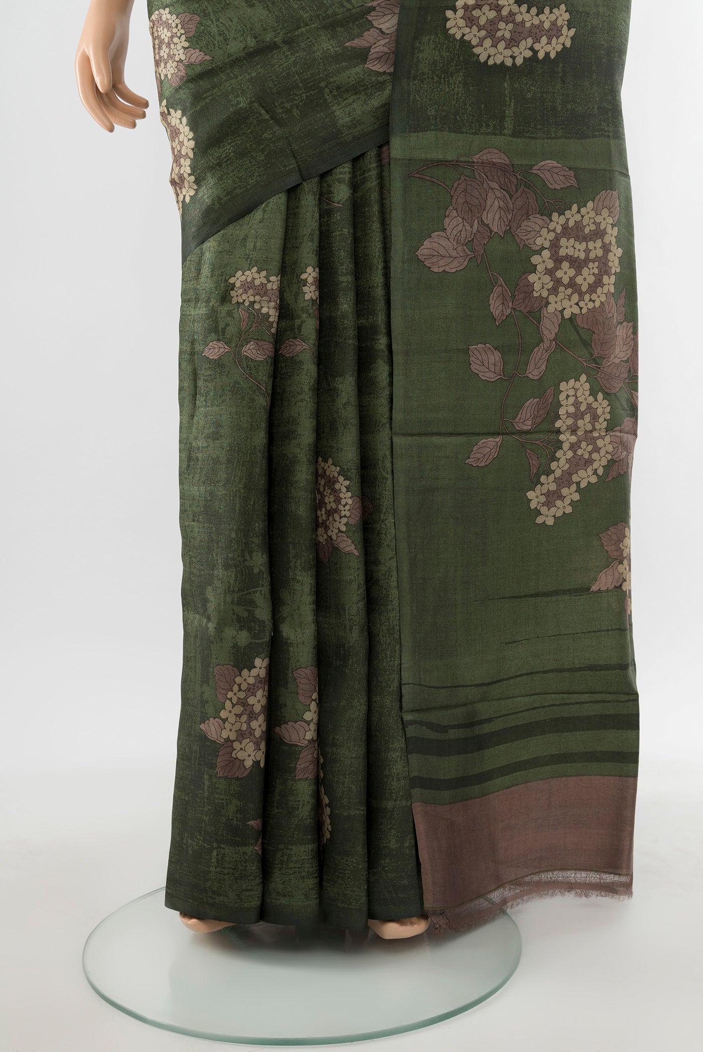 Pleats and pallu of Mint Green Tussar Silk Saree with Floral Print on the body and Silk Border. 