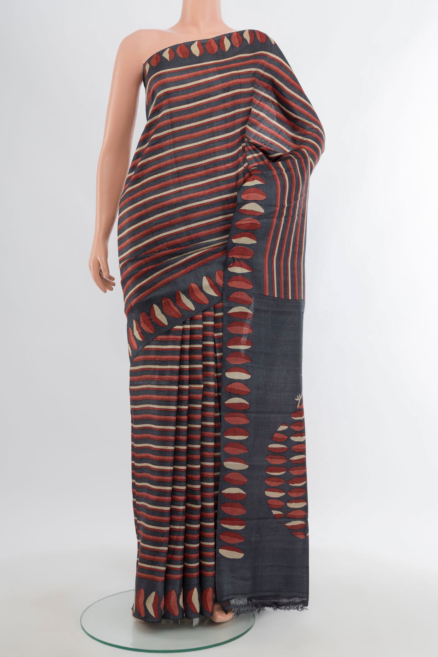 Multi Color Tussar Silk Saree with Printed design on the body and Printed Border.  displayed on a mannequin