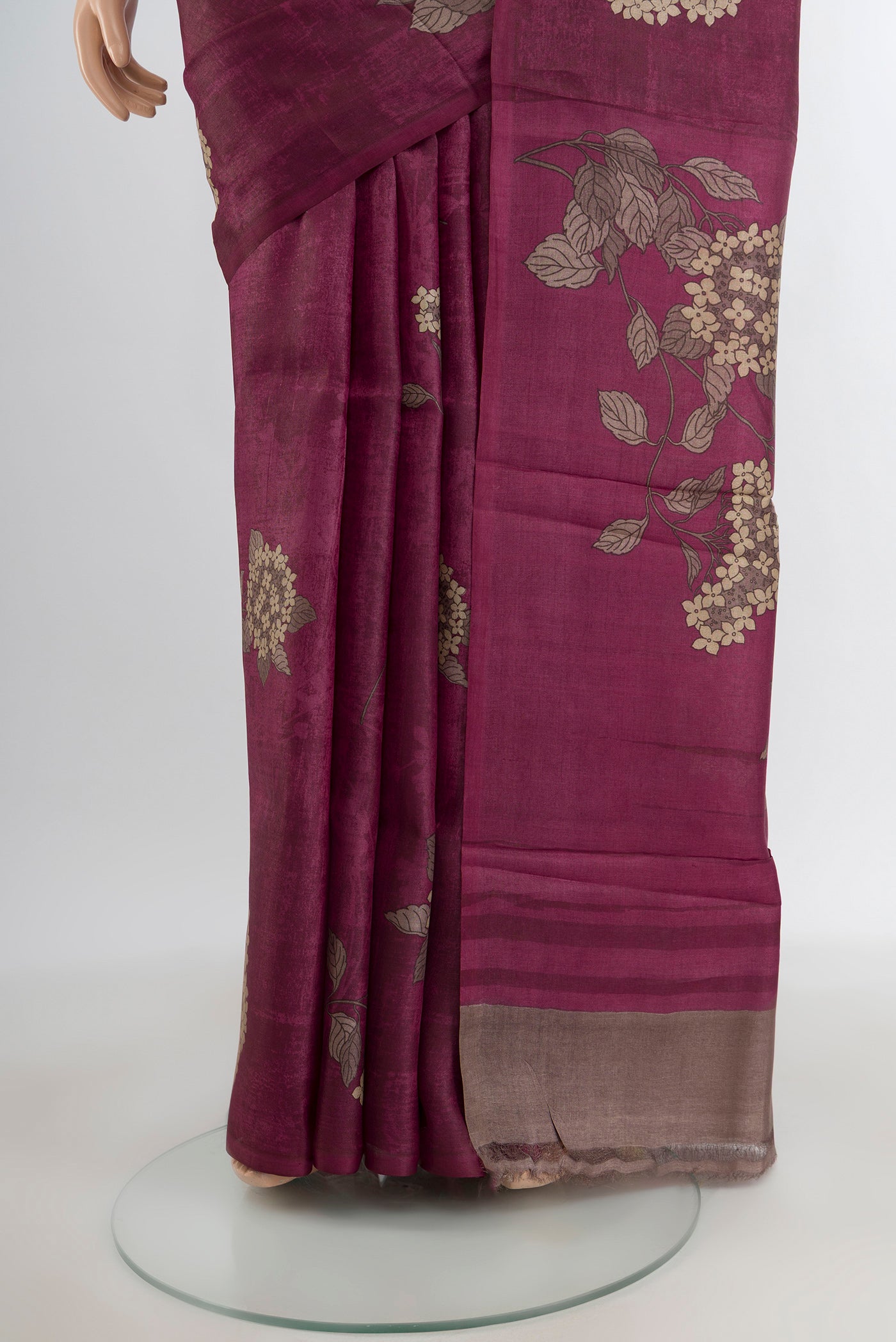 Pleats and pallu of Purple Tussar Silk Saree with Floral Print on the body and Without Border. 