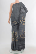 Davys Grey Tussar Silk Saree with Plain Body and Without Border.  displayed on a mannequin