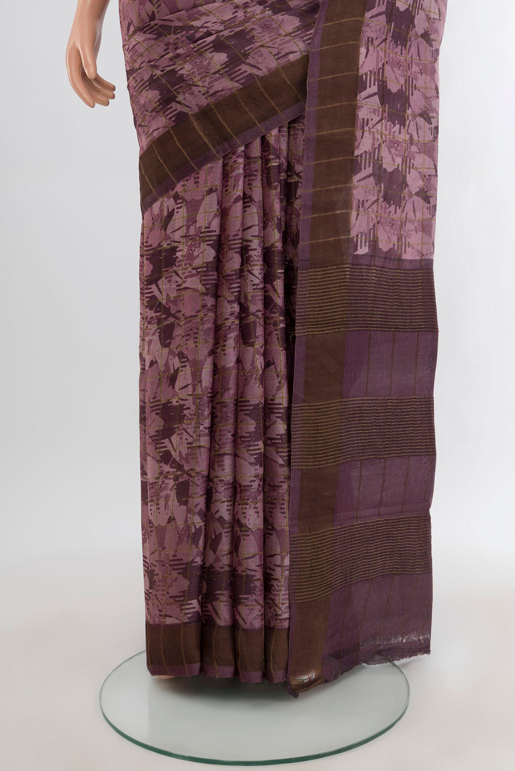 Pleats and pallu of Mauve Tussar Silk Saree with Floral Print on the body and Zari Border. 
