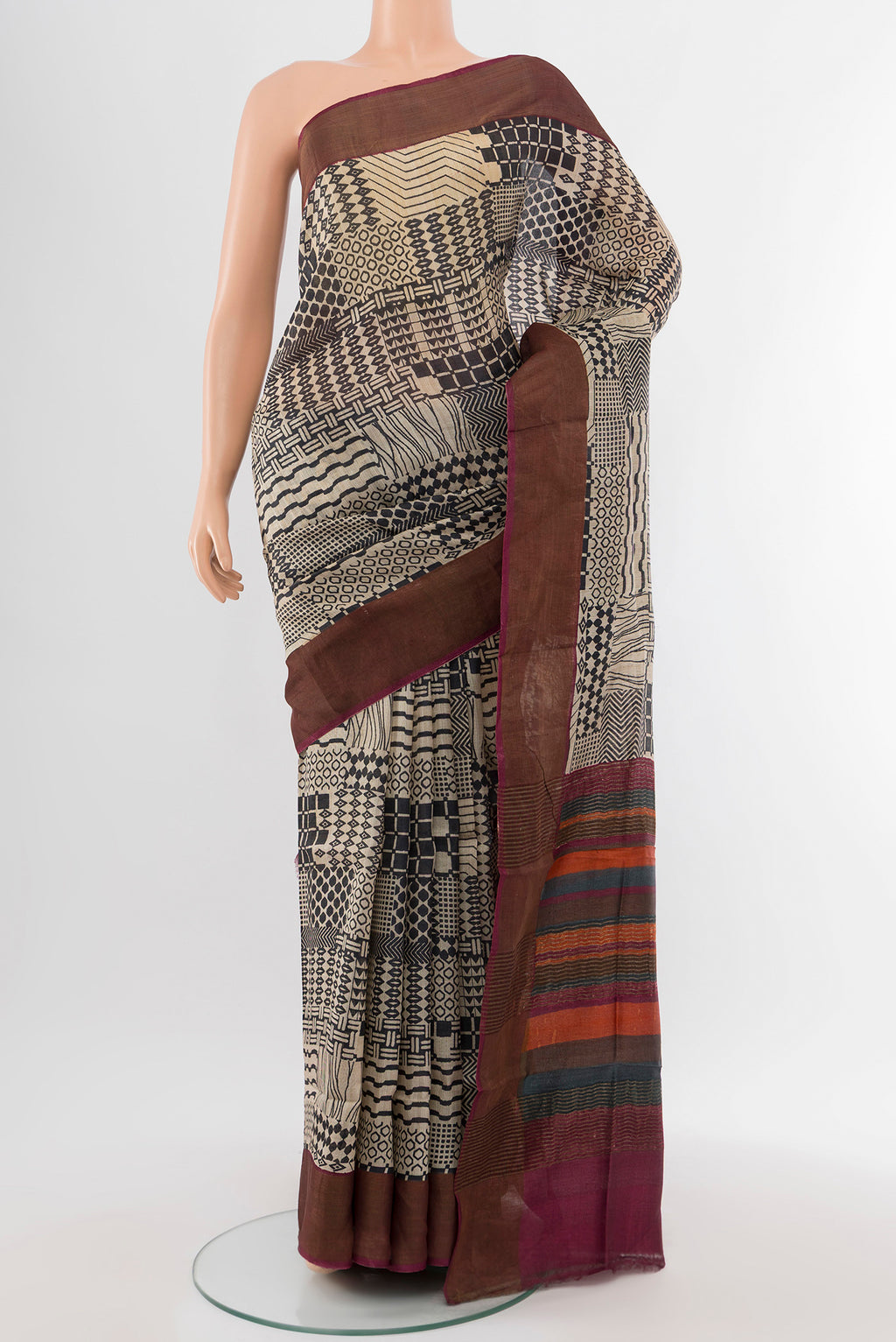 Multi Color Tussar Silk Saree with Floral Print on the body and Silk Border.  displayed on a mannequin